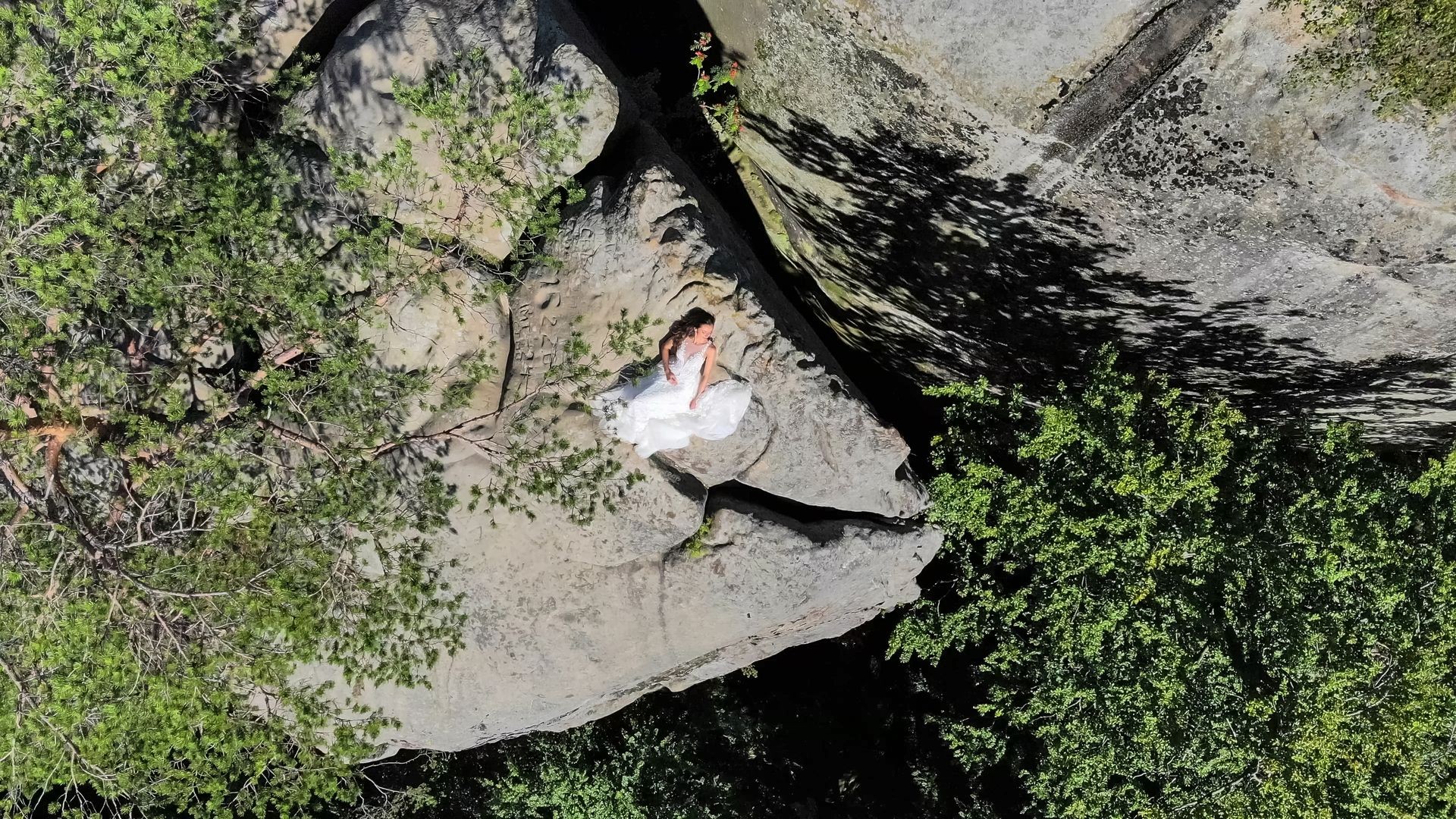 Aerial footage, Bride is on the edge of the abyss. High cliffs 